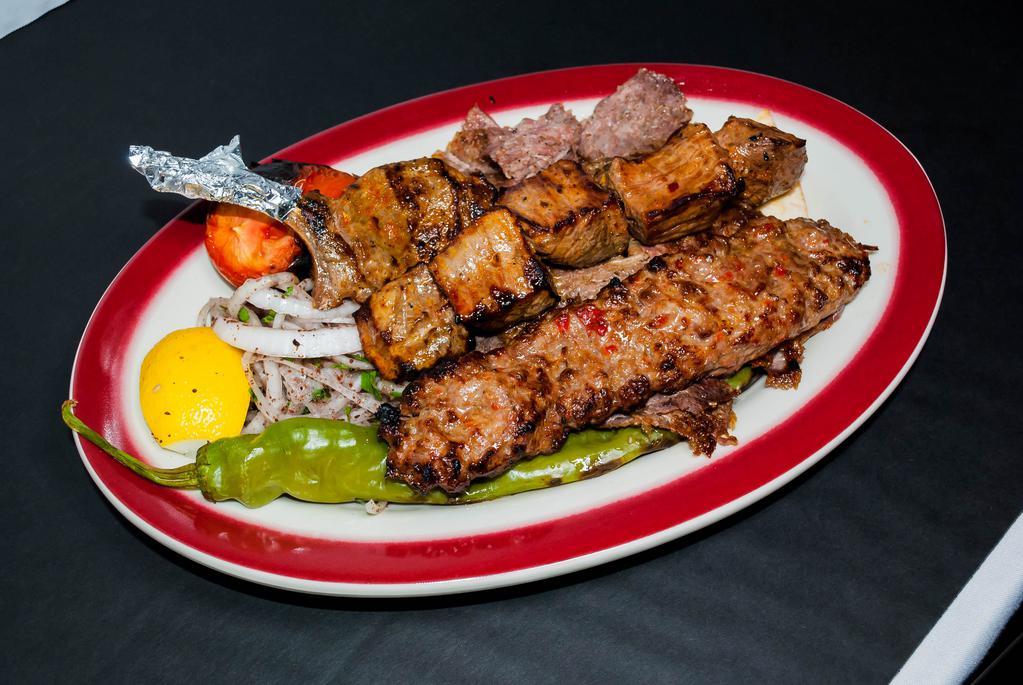 Mixed Grill · 
Mixed grill assortment of shish kebab, baby lamb chop, Adana kebab grilled to taste, served with tomatoes and green pepper with rice or french fries.