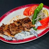 Lamb Chops · Baby lamb chops grilled to your taste served with green peppers and tomatoes with rice or fr...