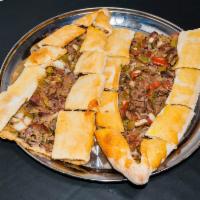Kusbasili Pide · A special pide topped with chopped 