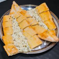 Beyaz Peynirli Pide · A crispy golden crust topped with feta cheese, parsley and dill.