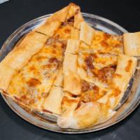 Sucuklu Kasarli Pide · A thin crust topped with Turkish sucuk (sausage) and mozzarella cheese.