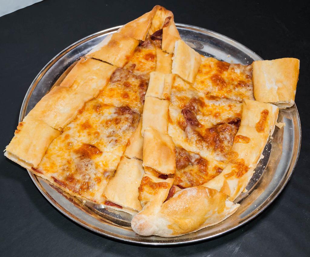 Sucuklu Kasarli Pide · A thin crust topped with Turkish sucuk (sausage) and mozzarella cheese.