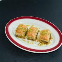 Baklava · Layers of very thin fillo dough layered with walnuts and pistachios then baked until golden ...