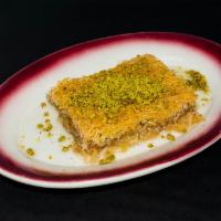 Kadayif · Shredded dough layered with walnuts and pistachios and served with honey syrup.