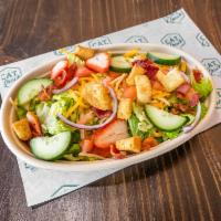 Shack Salad · Romaine lettuce, cucumbers, onions, tomatoes, cheddar cheese, croutons, bacon, served with s...