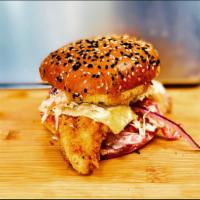 Bang-Bang Catfish Sandwich · Fried catfish, white cheddar cheese, tomato, onion, house-slaw and our signature Bang Bang s...