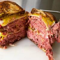 Corned Beef Sandwich Detroit · Style corned beef Swiss cheese, mustard serve on an onion roll or pile high.