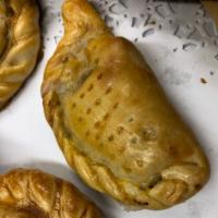 Ham and Cheese Empanada · Jamon y queso. Our special pastry dough simply filled with ham and cheese and oven baked.