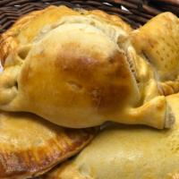 Cheese Empanada · Queso. Our special empanada pastry dough filled with cheese and baked.