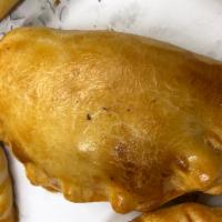 Tuna Empanada  · Another favorite Empanada filled with tuna and flavored with peppers and onions also oven ba...