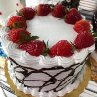Vanilla cake with chocolate and strawberry. 