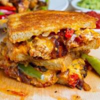 8. Chicken Fajita Panini · Grilled chicken, cheddar cheese, roasted peppers caramelized onion and salsa. On European fl...
