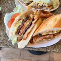 The Fat Greek Sandwiche · This mouthwatering sandwich features a sizzling beef gyro grilled and topped with chicken te...