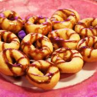 Cuzin's Duzins Mini Donuts (Funnel Cake Style) · Choice of powdered sugar and drizzle. Add toppings for additional cost.