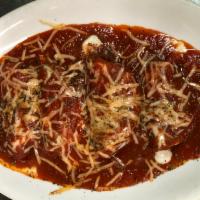Grilled Eggplant · Grilled slices of eggplant, rolled with mozzarella cheese, topped with marinara sauce, parme...