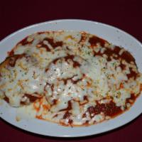 Eggplant a la Parmigiana · Freshly sliced egg plant, lightly breaded, fried and topped with meat or marinara sauce and ...