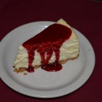 Raspberry White Chocolate Cheesecake · House made cheesecake made with Ghirardelli white chocolate and raspberry sauce.