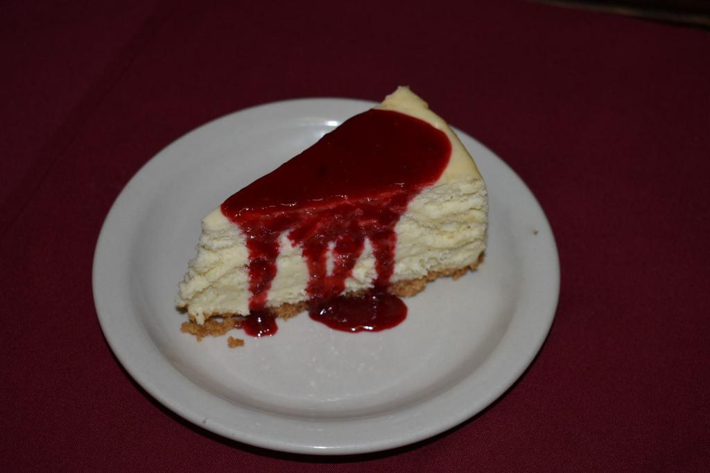 Raspberry White Chocolate Cheesecake · House made cheesecake made with Ghirardelli white chocolate and raspberry sauce.