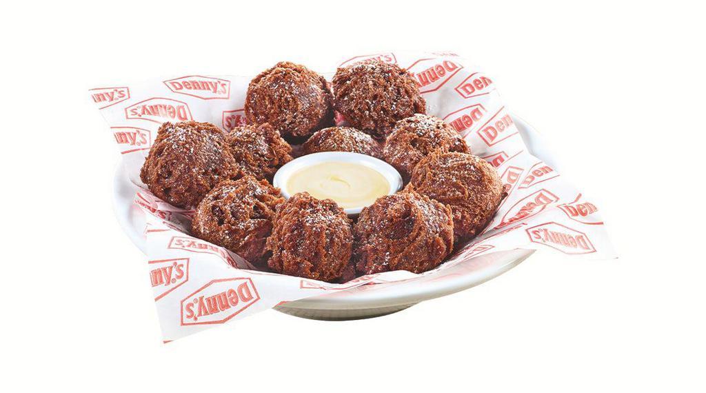 Double Chocolate Pancake Puppies® · Made with Ghirardelli® cocoa and chocolate chips, tossed in powered sugar and served with cream cheese icing.