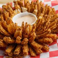 Bloomin' Onion · Hand-cut and battered fried jumbo onion. Served with our homemade comeback sauce. Yum-yum.