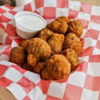 15 Piece Fried Mushrooms · Battered bite-sized fried mushrooms. Served with a side of ranch dressing.
