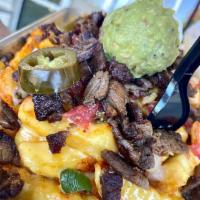 Carne Asada Fries · Crispy fries with fresh grilled carne asada beef, topped with melted cheese, bacon, pico de ...