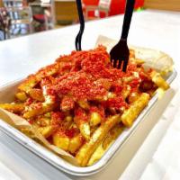 Flamin Hot Cheetos Fries · Crispy fries with melted cheese, topped with flamin hot cheetos.