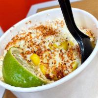 Mexican Street Corn · Our Mexican street style corn with cream, mayo, cotija cheese and chili powder.