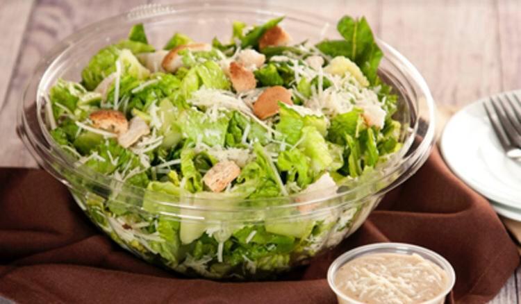 Classic Grilled Chicken Caesar Salad · Grilled chicken, romaine lettuce, garlic croutons, parmigiana cheese, grape tomatoes, creamy Caesar dressing.