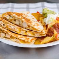 Quesadilla · Filled with pico de gallo, melted mixed cheese and served with salsa and sour cream.