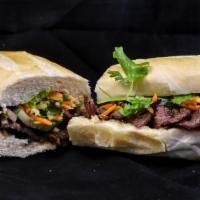 Banh Mi Sandwich · Toasted French baguette serve with choices of lettuce : pickle carrots and daikon or pickle ...