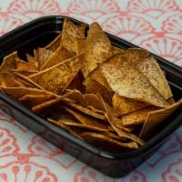 Taro Chips · Fresh sliced taro root, fried to a crisp, tossed with sesame oil and salt seasonings