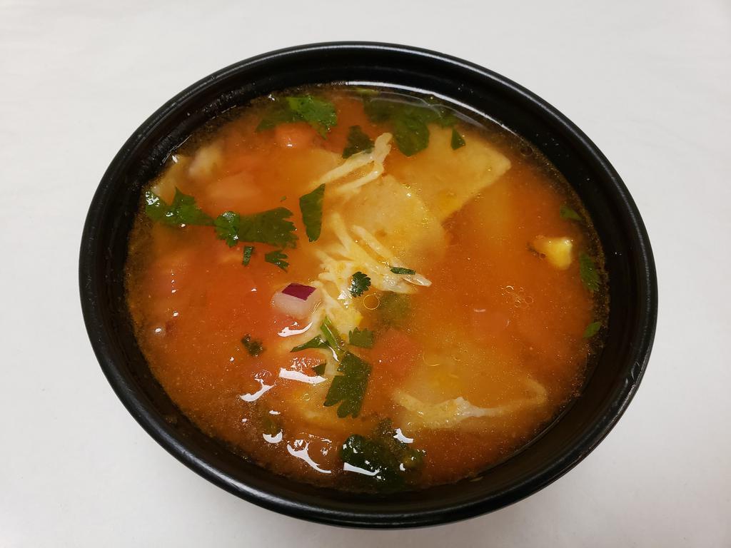 Bowl of Tortilla Soup · A hearty spicy broth with chunks of chicken, vegetables, and topped with tortilla strips and Jack cheese.