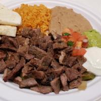 Fajitas Plate · Chunks of fajita steak or chicken. Served with sauteed onions and peppers, rice, pinto beans...