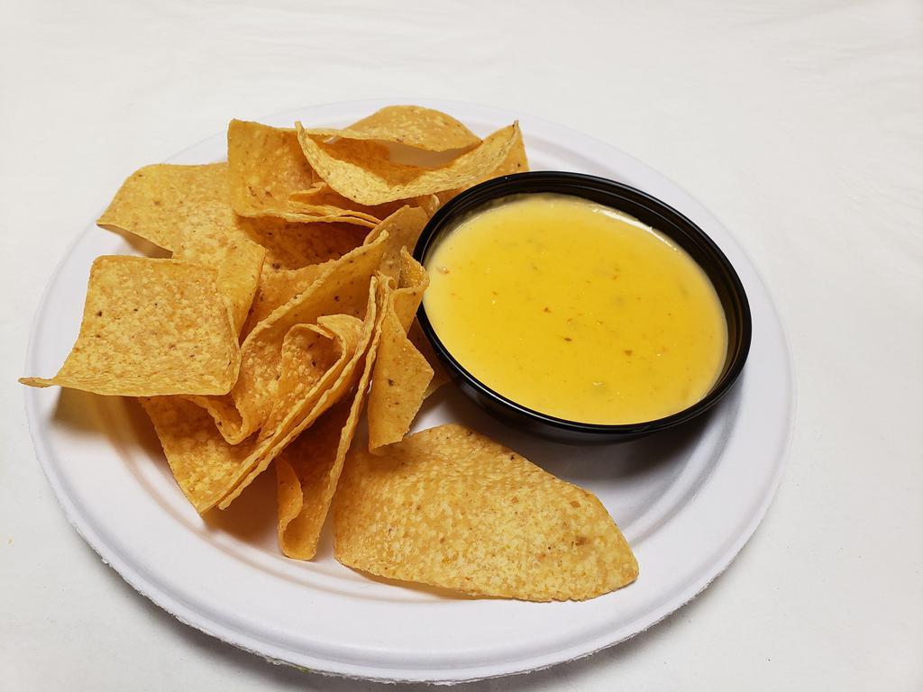 Chips and 8 oz. Queso · Melted cheese dip.