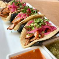 Pollo Pibil Tacos · achiote rubbed grilled chicken with cured red onions and cilantro, in corn tortillas