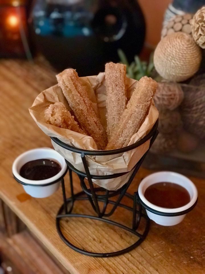 Churros · fried Mexican dough with cinnamon and sugar served with sweet milk and chocolate dipping sauces