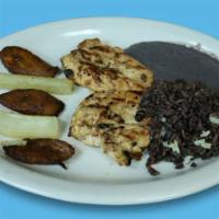 Pollo a la Parrilla Dish · Marinated chicken breast grilled and served with yuca, plantain, salvadorian rice, and black...