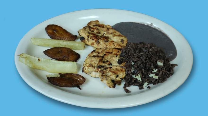 Pollo a la Parrilla Dish · Marinated chicken breast grilled and served with yuca, plantain, salvadorian rice, and black beans.