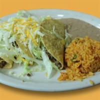 Crispy Taco Dinner · 3 crispy tacos with your choice of ground beef or shredded chicken. Served with lettuce, tom...