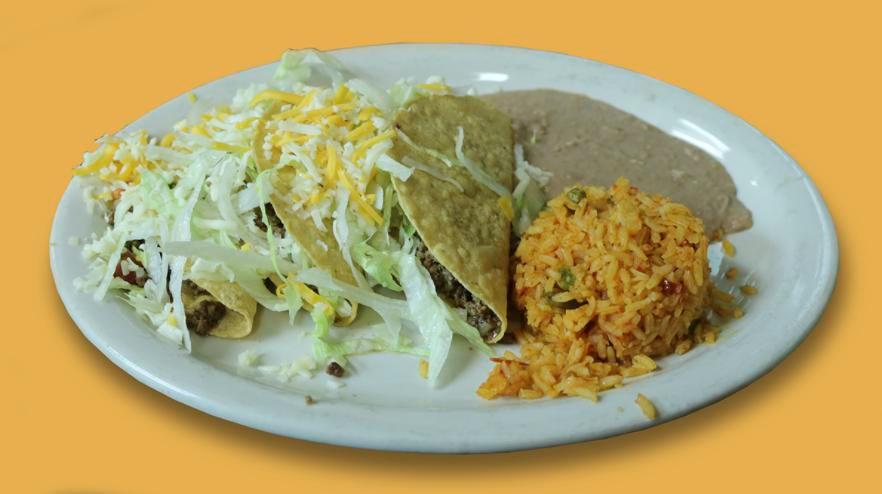 Crispy Taco Dinner · 3 crispy tacos with your choice of ground beef or shredded chicken. Served with lettuce, tomatoes, grated cheese, rice, and refried beans.