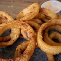 Onion Rings · Crispy onion rings served with a side of southwest ranch.