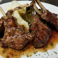 Broiled New Zealand Lamb Chops · Choice of red wine demi glaze or jerk sauce.
