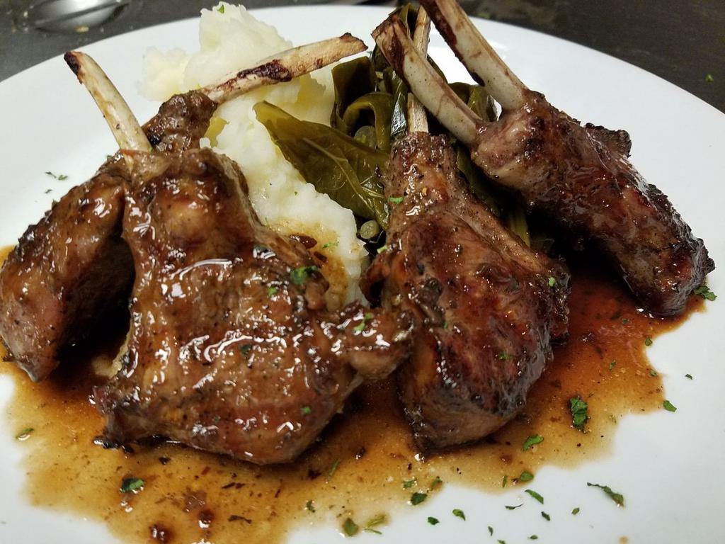 Broiled New Zealand Lamb Chops · Choice of red wine demi glaze or jerk sauce.