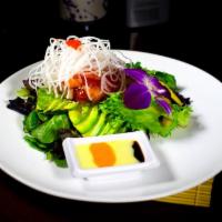 Sashimi Salad · Spring Mixed Salad On Top with Salmon, Tuna, White Tuna, Yellowtail, Avocado, Mango, Tobikos...
