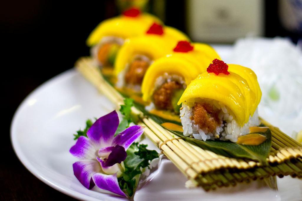 Amazing Roll · Spicy crunchy tuna and avocado inside, topped with fresh mango and tobiko.