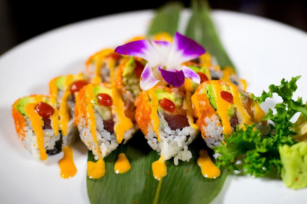Volcano Roll · Yellow fin tuna, Alaska salmon, avocado and cucumber inside caviar and two kinds spicy sauce on top.