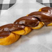 Chocolate Glazed Twist · Long twisted donut with chocolate icing.