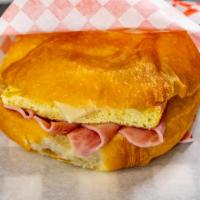 Ham, Egg, and Cheese Croissant · A flaky croissant with ham, egg and cheese.