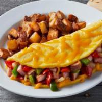 WESTERN OMELETTE ·  Any style eggs, ham, pepper, tomatoes and red onions